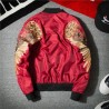 Black bomber jacket with embroidered golden wingsJackets
