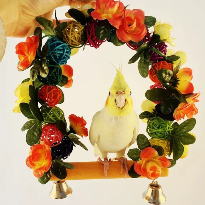 AvesWooden bird swing - with flowers / bells decoration