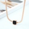CollarRose gold snake chain necklace - with black charm