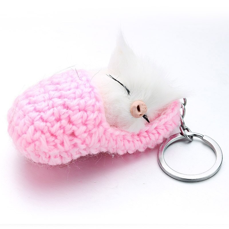 Sleeping cat in a hand-woven cot - keychainKeyrings