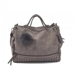 BolsasBolso vintage de piel nubuck con remaches / pompón de pelo