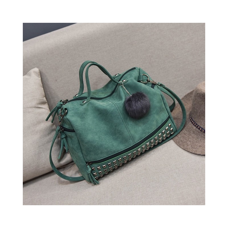 BolsasBolso vintage de piel nubuck con remaches / pompón de pelo