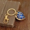 Crystal heart in golden cage - keychainKeyrings