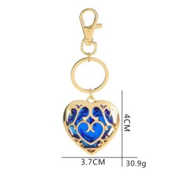 Crystal heart in golden cage - keychainKeyrings