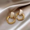 Elegant golden round earrings - with white opalEarrings