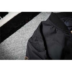 Black bomber jacket with embroidered golden wingsJackets