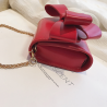 BolsasBolso pequeño y elegante con cadena de arco