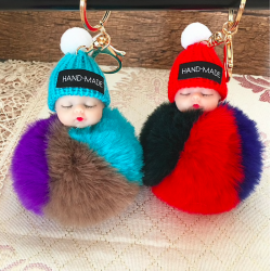 Sleeping baby doll - keychain with fur pompomKeyrings