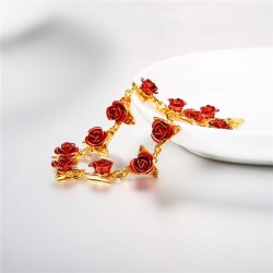 Gold & silver bracelet with red rosesBracelets