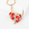 llaveroCorazón de cristal con flores rojas - llavero